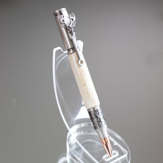 Decorative pen with a white handle and silver accents on a gray background