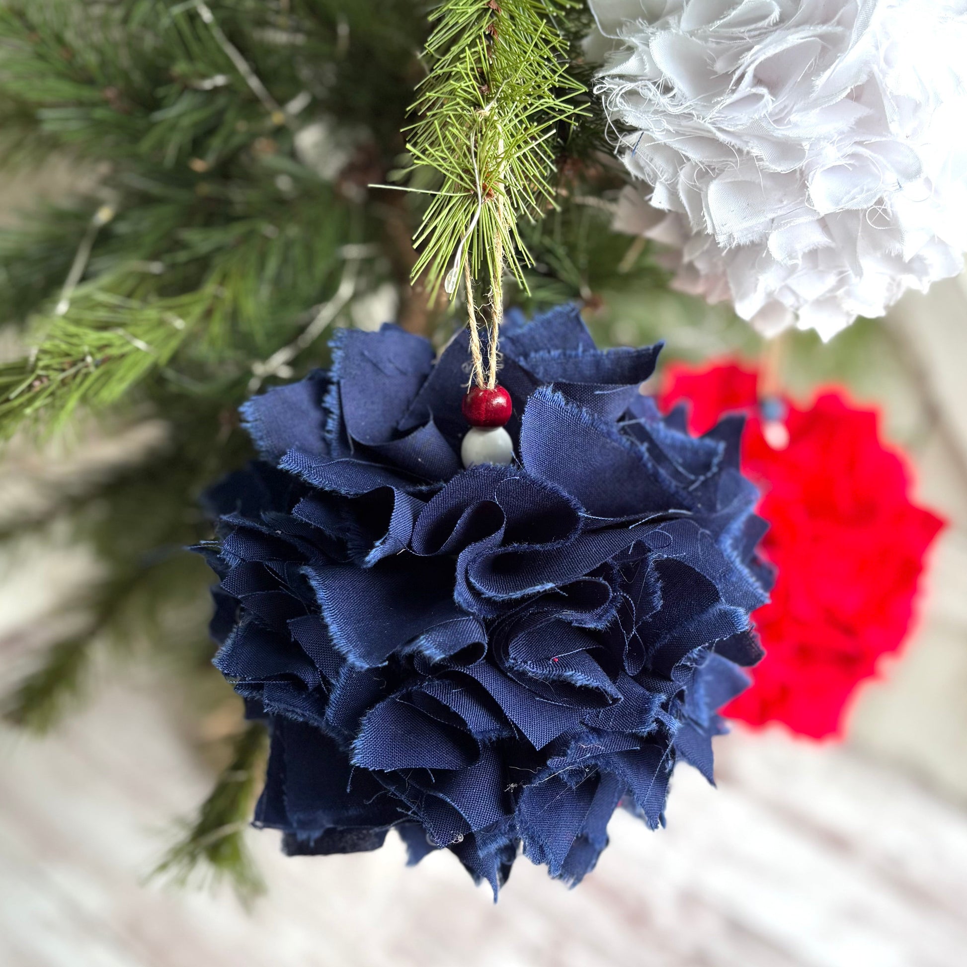 Decorative ornaments on a Christmas tree with a white background
