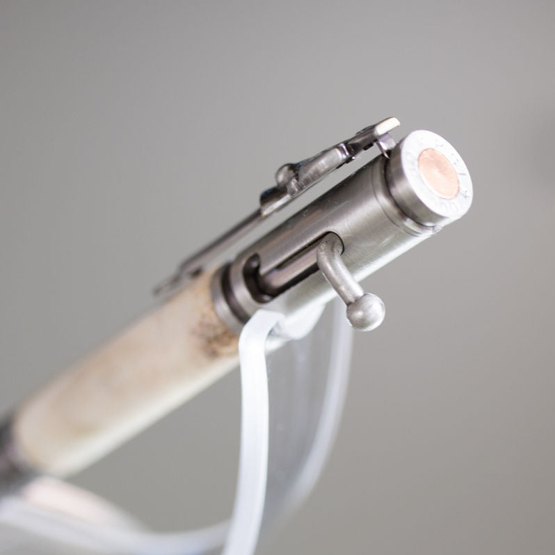 Close up of the bolt action antique pewter pen made with deer antler.